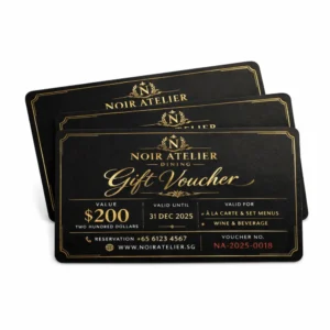 Luxury restaurant gift voucher printing Singapore with black and gold foil finish and premium card design